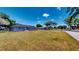 Well-maintained front yard with lush grass, showcasing the home's curb appeal and inviting exterior at 1515 W Lake Cannon Nw Dr, Winter Haven, FL 33881