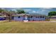 Charming single-story home with a well-maintained lawn and neat landscaping at 1515 W Lake Cannon Nw Dr, Winter Haven, FL 33881
