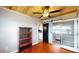 Cozy living room features wood floors, wood ceiling, a sliding barn door and built in glass cabinet at 1515 W Lake Cannon Nw Dr, Winter Haven, FL 33881