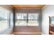 Bright living room featuring hardwood floors, and a large window providing natural light and exterior views at 1515 W Lake Cannon Nw Dr, Winter Haven, FL 33881