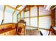Close up view of storage shed showcasing its wooden beams and white walls at 1515 W Lake Cannon Nw Dr, Winter Haven, FL 33881