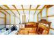 Spacious storage shed featuring wooden beams and white walls at 1515 W Lake Cannon Nw Dr, Winter Haven, FL 33881