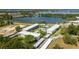 Gorgeous aerial view of the community and nearby lake with building exterior and parking visible at 1700 6Th Nw St # C26, Winter Haven, FL 33881