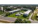 Lovely aerial view of the property showcasing the community pool, lawn and building exterior at 1700 6Th Nw St # C26, Winter Haven, FL 33881