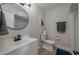 Well-lit bathroom with a modern sink, toilet, and contemporary decor at 1700 6Th Nw St # C26, Winter Haven, FL 33881
