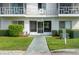 Inviting building entrance with well-kept landscaping and easy access at 1700 6Th Nw St # C26, Winter Haven, FL 33881