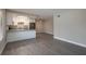 An open layout kitchen featuring stone countertops and stainless steel appliances at 1700 6Th Nw St # C26, Winter Haven, FL 33881