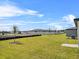 Expansive backyard featuring lush green grass, newly planted trees and a fence, providing privacy and ample space at 1752 Forest Run Ln, Auburndale, FL 33823