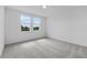 Bright bedroom featuring neutral carpeting and large windows at 1752 Forest Run Ln, Auburndale, FL 33823