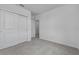 Neutral bedroom featuring carpeting and a closet with sliding doors at 1752 Forest Run Ln, Auburndale, FL 33823