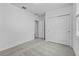Neutral bedroom featuring carpeting, a closet and an open doorway at 1752 Forest Run Ln, Auburndale, FL 33823