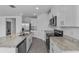 Bright kitchen with granite counters, stainless appliances, and ample cabinet space at 1752 Forest Run Ln, Auburndale, FL 33823