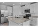 Modern kitchen with stainless steel appliances, granite countertops, and white cabinetry at 1752 Forest Run Ln, Auburndale, FL 33823