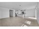 Spacious open floor plan with modern kitchen and a combined living area with tile floors at 1752 Forest Run Ln, Auburndale, FL 33823