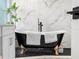 Close-up of a freestanding tub with gold feet sitting in a luxury bathroom at 1850 S Lake Reedy Blvd, Frostproof, FL 33843