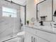 Modern bathroom featuring a glass shower with marble and a sleek vanity with a stylish mirror at 1850 S Lake Reedy Blvd, Frostproof, FL 33843