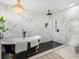 Elegant bathroom featuring a freestanding tub and a rainfall shower head at 1850 S Lake Reedy Blvd, Frostproof, FL 33843
