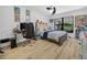 Spacious bedroom featuring light wood floors, neutral walls, and a comfortable bed and ceiling fan at 1850 S Lake Reedy Blvd, Frostproof, FL 33843