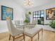 Dining room featuring modern furniture, a chandelier, hardwood flooring, and modern art at 1850 S Lake Reedy Blvd, Frostproof, FL 33843
