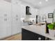 Kitchen featuring all white cabinets, a pantry, stainless steal appliances and a backsplash at 1850 S Lake Reedy Blvd, Frostproof, FL 33843