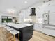 Modern kitchen featuring a center island, stainless appliances, and white cabinetry at 1850 S Lake Reedy Blvd, Frostproof, FL 33843
