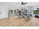 Bright living area with wood floors, ceiling fan, and lots of natural light at 1850 S Lake Reedy Blvd, Frostproof, FL 33843