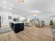 Open living room featuring hardwood floors, access to a kitchen and ample seating at 1850 S Lake Reedy Blvd, Frostproof, FL 33843