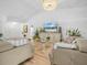 Inviting living room features light walls and wood flooring that complement neutral furniture at 1850 S Lake Reedy Blvd, Frostproof, FL 33843