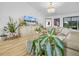 Living room area featuring couches, hardwood flooring, an entertainment center and a chandelier at 1850 S Lake Reedy Blvd, Frostproof, FL 33843