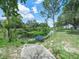 Scenic shot of a pond and lush greenery, creating a peaceful and relaxing outdoor environment at 1850 S Lake Reedy Blvd, Frostproof, FL 33843