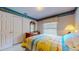 Cozy bedroom with double bed, with closet storage, and warm, inviting decor, creating a peaceful retreat at 1902 Southern Dunes Blvd, Haines City, FL 33844