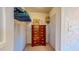 Walk-in closet featuring a built-in wooden dresser for enhanced storage solutions and organization at 1902 Southern Dunes Blvd, Haines City, FL 33844