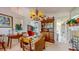 Dining room with wooden furniture, chandelier, and decorative elements; open to other living spaces at 1902 Southern Dunes Blvd, Haines City, FL 33844