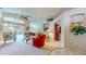Open living room featuring high ceilings, neutral walls, tile and carpet flooring and backyard access at 1902 Southern Dunes Blvd, Haines City, FL 33844