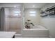 Bathroom featuring a separate tiled shower and soaking tub, with modern fixtures and finishes at 1949 Old Bartow Rd, Lake Wales, FL 33859