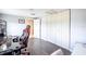 Cozy bedroom featuring wood floors, a gaming setup, and a closet for ample storage at 1949 Old Bartow Rd, Lake Wales, FL 33859