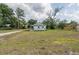 Charming single-story home with a well-manicured lawn and inviting curb appeal on a sunny day at 1949 Old Bartow Rd, Lake Wales, FL 33859