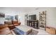 Spacious living room with comfortable seating, large TV, and modern décor for relaxation and entertainment at 1949 Old Bartow Rd, Lake Wales, FL 33859