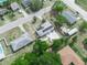 Aerial view featuring solar panels, accessory structure and close proximity to neighbors at 2100 Magnolia Ave, Haines City, FL 33844