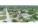 An expansive aerial view shows the property's location within a suburban landscape with a pool nearby at 2100 Magnolia Ave, Haines City, FL 33844