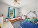 bedroom with two beds, window, carpet and ceiling fan at 2100 Magnolia Ave, Haines City, FL 33844