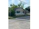 Modest single-story home with neutral siding, surrounded by trees at 217 Nw 4Th Ave, Mulberry, FL 33860