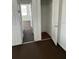 Hallway leading to bedroom, featuring wood floors in closet at 217 Nw 4Th Ave, Mulberry, FL 33860