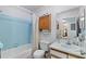Bathroom features blue tile and bathtub/shower combination at 2180 San Marcos Se Cir # 401, Winter Haven, FL 33880
