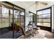 Enclosed porch featuring tile floors and ceiling fan for your comfort at 2180 San Marcos Se Cir # 401, Winter Haven, FL 33880
