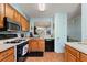 Kitchen with appliances and tile flooring, open to living area at 2180 San Marcos Se Cir # 401, Winter Haven, FL 33880