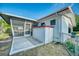 The home's backyard features a screened-in porch and a well-maintained lawn at 230 W Harbord St, Lake Alfred, FL 33850