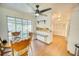 Bright dining area with sliding glass doors, open to the kitchen, featuring laminate floors at 230 W Harbord St, Lake Alfred, FL 33850