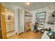 Versatile storage area with shelves and a window, leading to a bathroom with a vanity at 230 W Harbord St, Lake Alfred, FL 33850