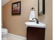Charming bathroom with vanity, framed movie poster and toilet at 250 Brigham Nw Rd, Winter Haven, FL 33881